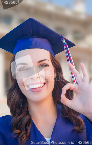 Image of Happy Graduating Mixed Race Woman In Cap and Gown Celebrating on