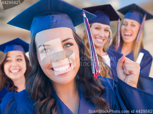 Image of Happy Graduating Group of Girls In Cap and Gown Celebrating on C