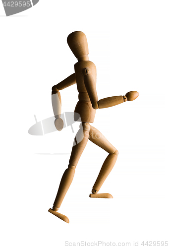 Image of Wooden mannequin running upstairs