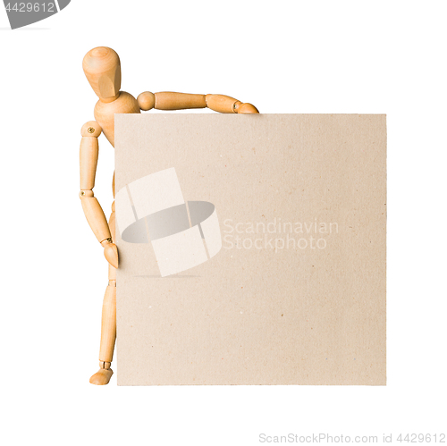 Image of Wooden model dummy holding blank carton board