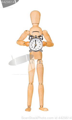 Image of Wooden model dummy holding alarm-clock