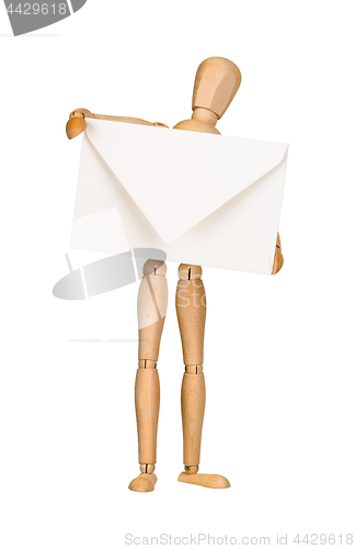 Image of Wooden model dummy holding envelop