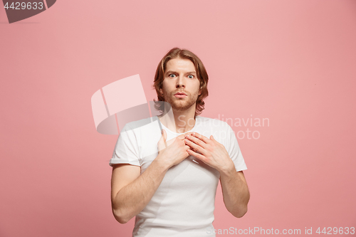 Image of Portrait of the scared man on pink