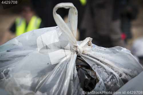 Image of Picking up Plastic Waste