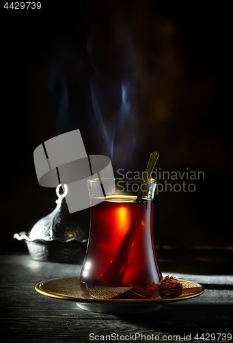 Image of Turkish tea on black background