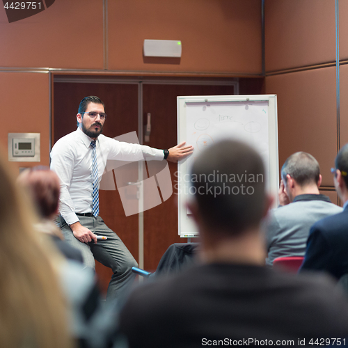 Image of Speaker Giving a Talk at Business Meeting.