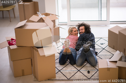 Image of Young couple moving in a new flat