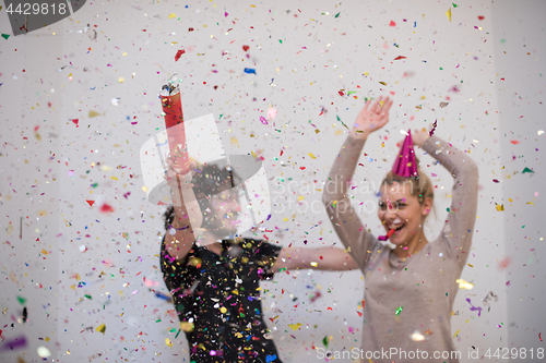 Image of romantic young  couple celebrating  party with confetti