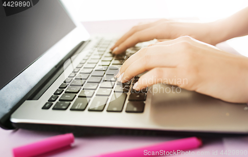 Image of Woman working on computer in office