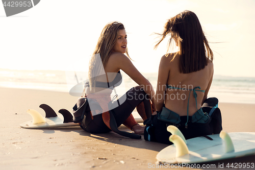 Image of Surfer girls at the beach 