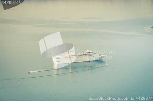 Image of Cruise liner at the sea near the Nea Kameni, a small Greek island in the Aegean Sea near Santorini