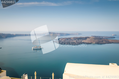 Image of Beautiful landscape with sea view. Cruise liner at the sea near the Nea Kameni, a small Greek island in the Aegean Sea near Santorini