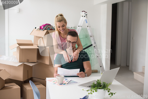 Image of Young couple moving in a new home