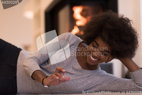 Image of black women using tablet computer on the floor
