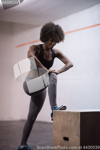 Image of black woman are preparing for box jumps at gym