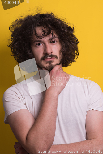 Image of young man with funny hair over color background