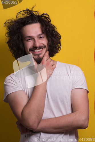 Image of young man with funny hair over color background