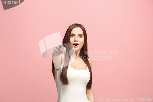 Image of The happy business woman point you and want you, half length closeup portrait on pink background.