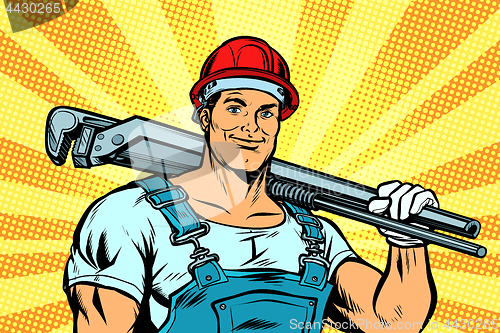 Image of pop art plumber worker with adjustable wrench