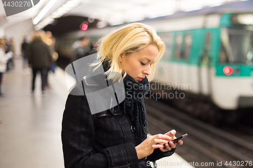 Image of Woman on a subway station.