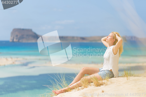 Image of Relaxed Happy Woman Enjoying Sun on Vacations.