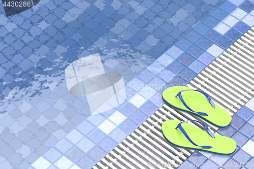 Image of Flip flops by the swimming pool