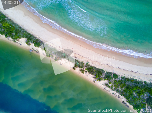 Image of Where the river hugs the ocean scenic aerial view