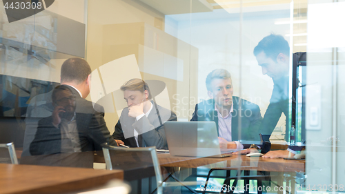 Image of Business people sitting and brainstorming at corporate meeting.