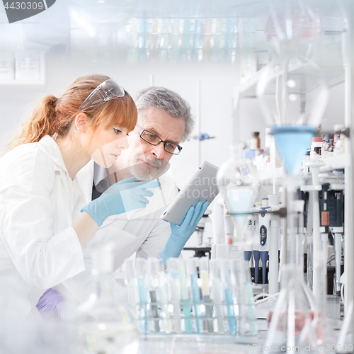 Image of Health care researchers working in scientific laboratory.