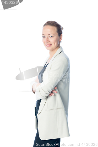 Image of Business woman standing with arms crossed against white background.