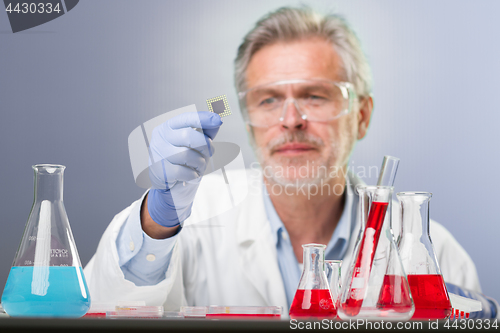 Image of Senior life science research researching in modern scientific laboratory.