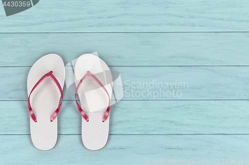 Image of Flip flops on wooden floor 