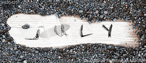 Image of Sand on planked wood - July