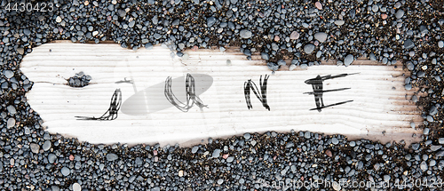 Image of Sand on planked wood - June