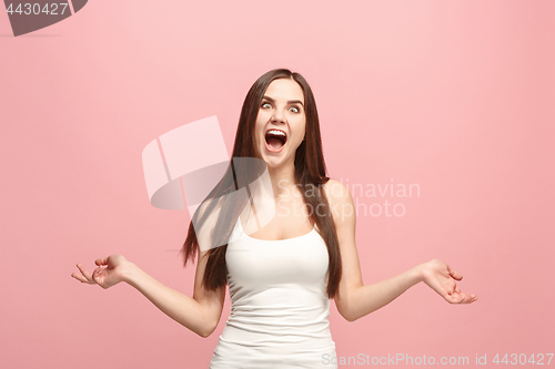 Image of The squint eyed woman with weird expression isolated on pink