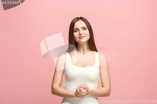 Image of Let me think. Doubtful pensive woman with thoughtful expression making choice against pink background