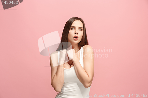 Image of Let me think. Doubtful pensive woman with thoughtful expression making choice against pink background