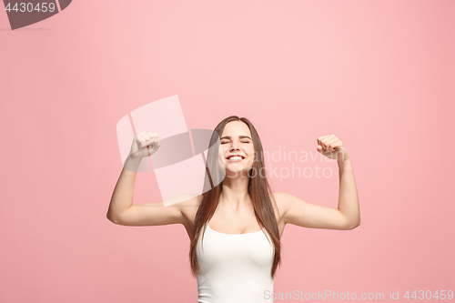 Image of Winning success woman happy ecstatic celebrating being a winner. Dynamic energetic image of female model