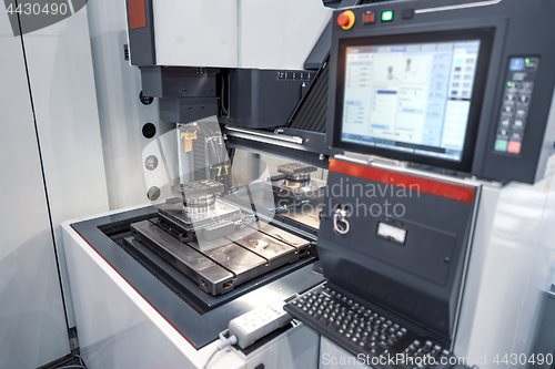 Image of Metalworking CNC milling machine. Cutting metal modern processin