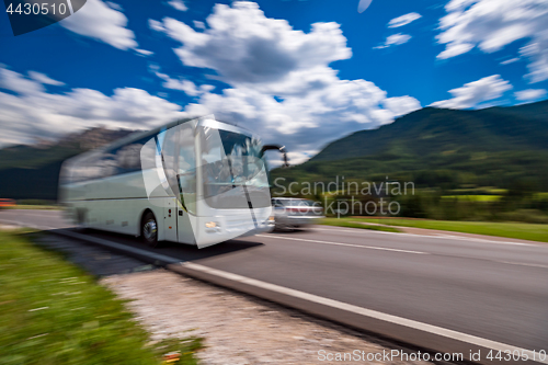 Image of Tourist bus traveling on the road