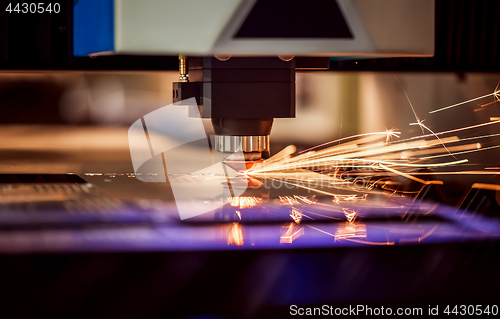 Image of CNC Laser cutting of metal, modern industrial technology.