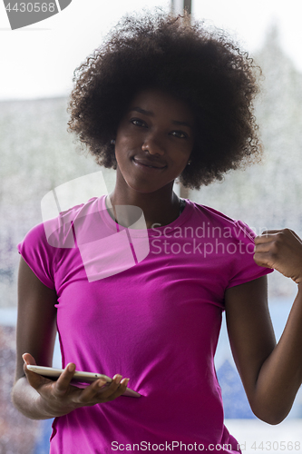 Image of african american woman using tablet