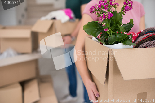 Image of young couple moving into a new home