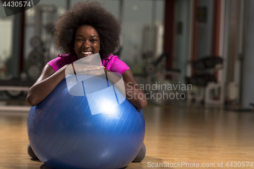 Image of woman  relaxing after pilates workout