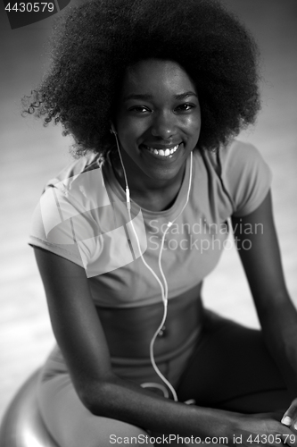 Image of woman  relaxing after pilates workout