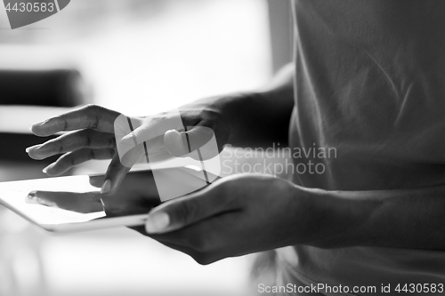 Image of african american woman using tablet