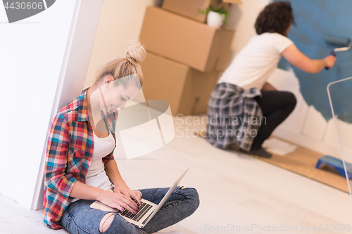 Image of Happy couple doing home renovations