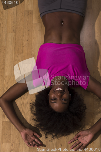 Image of woman  relaxing after pilates workout