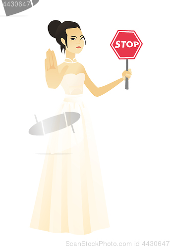 Image of Asian fiancee holding stop road sign.