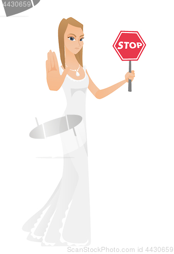 Image of Caucasian fiancee holding stop road sign.